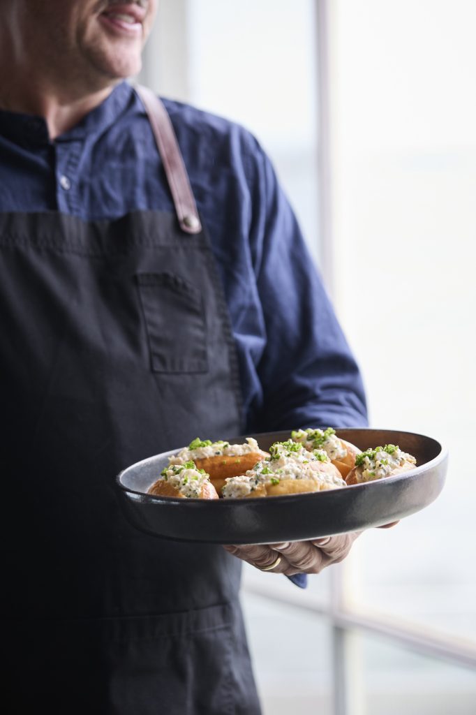 Waiter holding a platter for cold canape finger food options